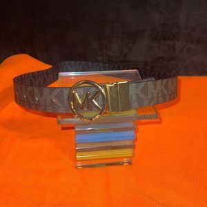 Michael Kors belt reversible with gold Mk hardware ; side one brown and gold sid
